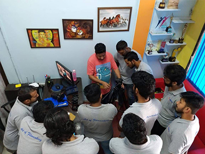 Photography students learning camera techniques and lighting at MDFA